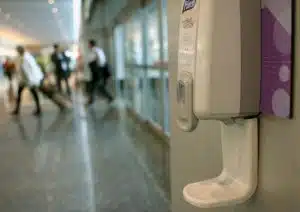 Hand sanitiser in the hallway near a clinic doing antigen testing kit and full allergy profile